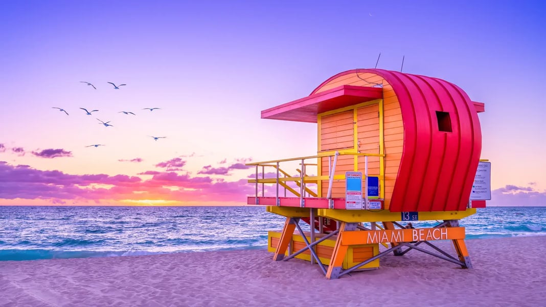 An Orange Miami Beach Shack on the Beach, Purple Sky, Wavy Blue Sea